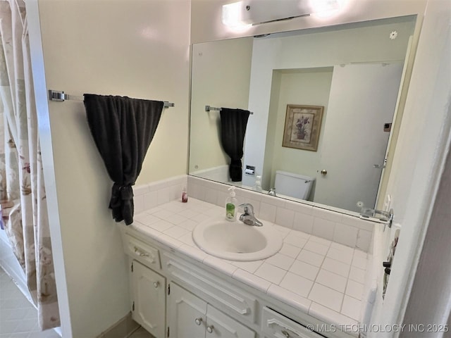 bathroom with vanity and toilet