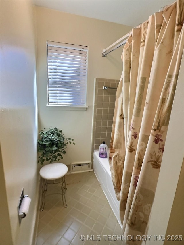 full bath featuring shower / tub combo, visible vents, and tile patterned floors