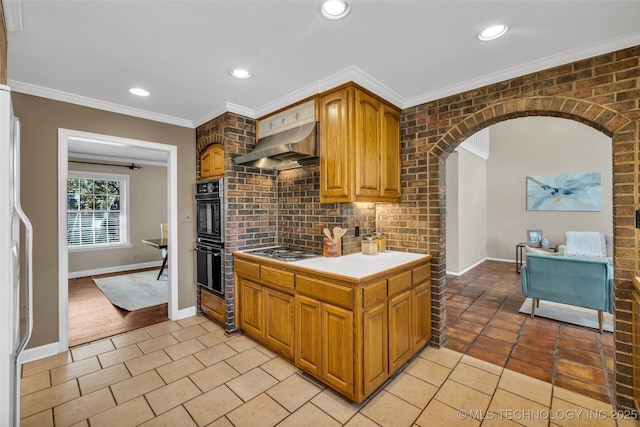 kitchen featuring arched walkways, stainless steel gas cooktop, decorative backsplash, ornamental molding, and wall chimney exhaust hood