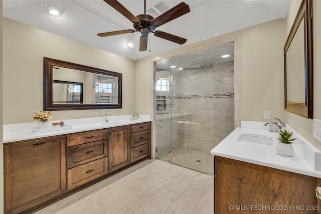 bathroom featuring ceiling fan, a stall shower, and vanity