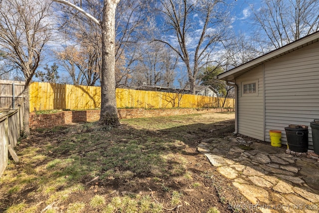 view of yard with a fenced backyard