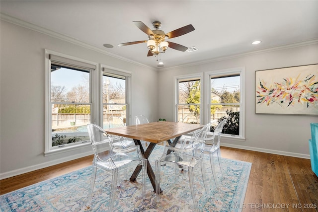 dining space featuring baseboards and ornamental molding