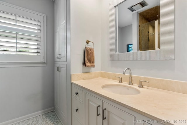 bathroom featuring baseboards and vanity