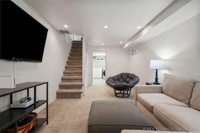 living area featuring stairs, carpet, washing machine and dryer, and recessed lighting