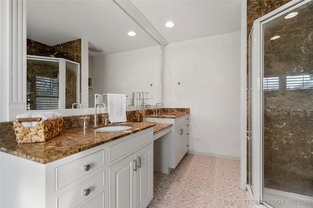 bathroom with tile patterned flooring, recessed lighting, two vanities, a sink, and a shower stall