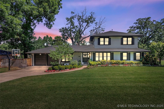 view of front of house with a chimney, an attached garage, a front yard, fence, and driveway