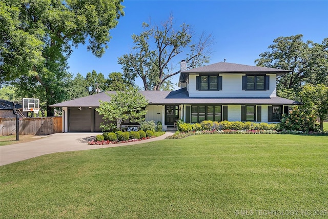 view of front of house with concrete driveway, a chimney, an attached garage, fence, and a front yard