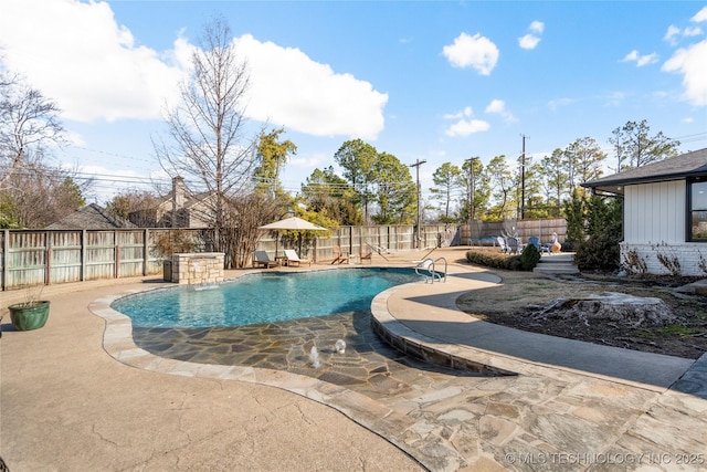 view of swimming pool with a fenced in pool, a patio area, and a fenced backyard