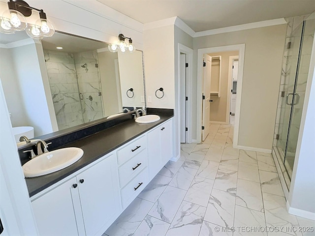 full bathroom featuring marble finish floor, a shower stall, ornamental molding, and a sink