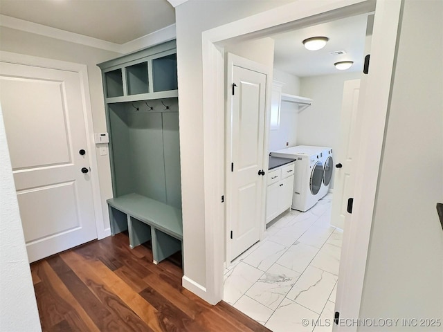 mudroom with marble finish floor and washing machine and dryer