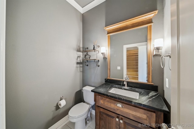 bathroom with vanity, toilet, and tile patterned floors