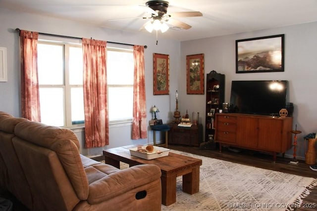 living room with a ceiling fan and wood finished floors