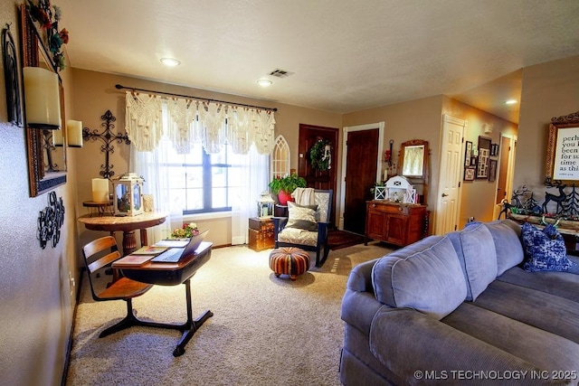 living room with carpet and visible vents