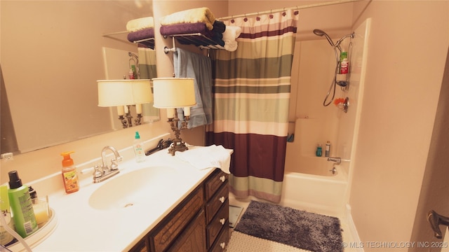 bathroom featuring shower / bath combo with shower curtain and vanity