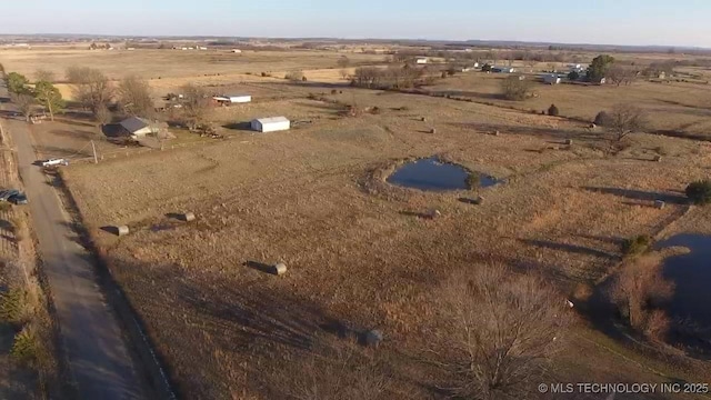 birds eye view of property with a rural view