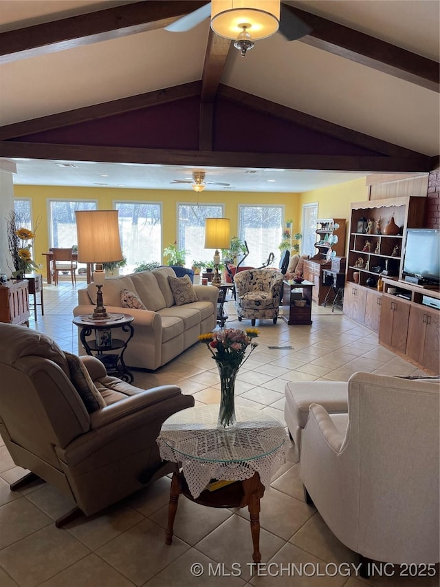 living room featuring vaulted ceiling with beams and light tile patterned floors