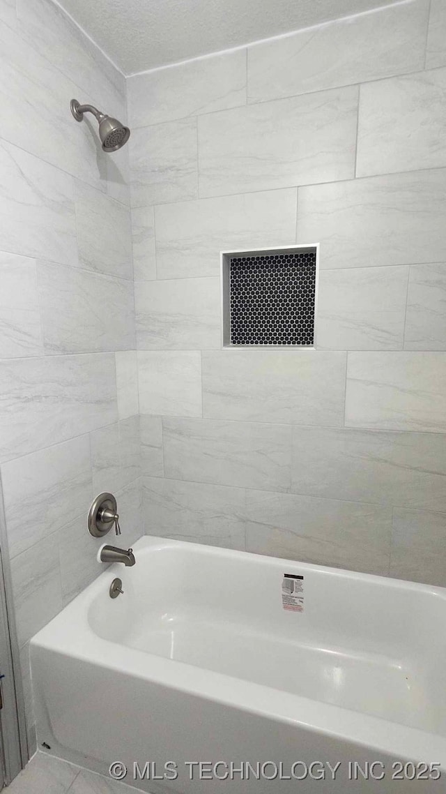 bathroom with  shower combination and visible vents