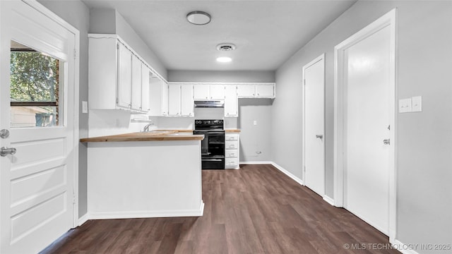 kitchen with dark wood finished floors, white cabinetry, a peninsula, black range with electric cooktop, and under cabinet range hood