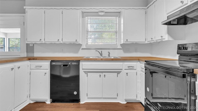 kitchen featuring dark wood-style flooring, white cabinets, a sink, under cabinet range hood, and black appliances