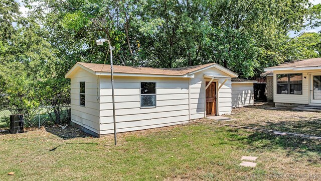413 NW 15 NW, Ardmore, OK 73401 - view of outbuilding featuring fence and an outdoor structure