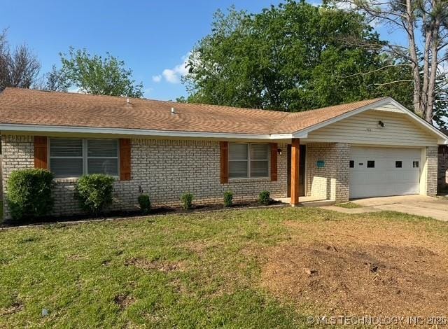 413 NW 15 NW, Ardmore, OK 73401 - single story home featuring a garage, brick siding, a front lawn, and driveway