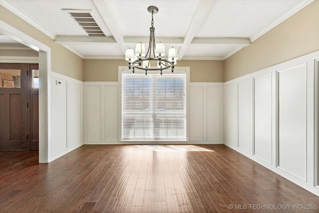 unfurnished dining area with dark wood-style flooring, visible vents, a decorative wall, and beamed ceiling