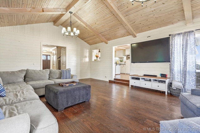 living room with wooden ceiling, wood finished floors, vaulted ceiling with beams, wood walls, and a notable chandelier