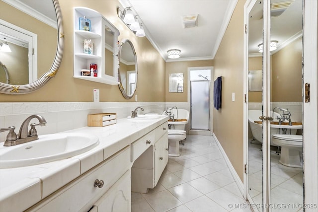 bathroom with ornamental molding, tile patterned flooring, a sink, and toilet