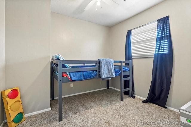 bedroom with carpet, a ceiling fan, and baseboards