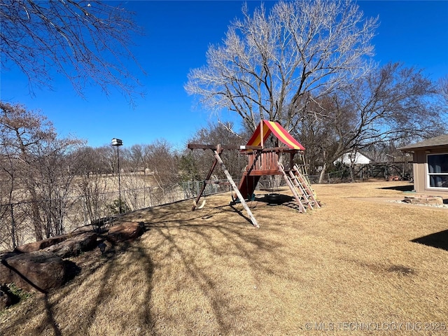 view of yard with fence and playground community