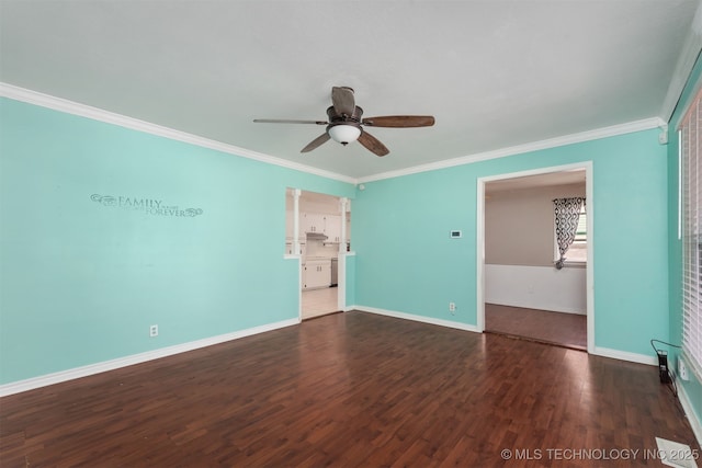 unfurnished room with ornamental molding, baseboards, and wood finished floors