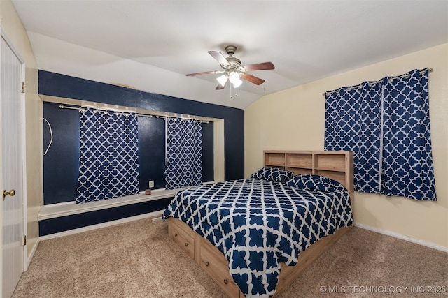 bedroom with ceiling fan, baseboards, vaulted ceiling, and carpet flooring