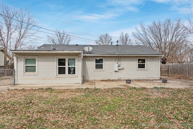 back of house featuring fence