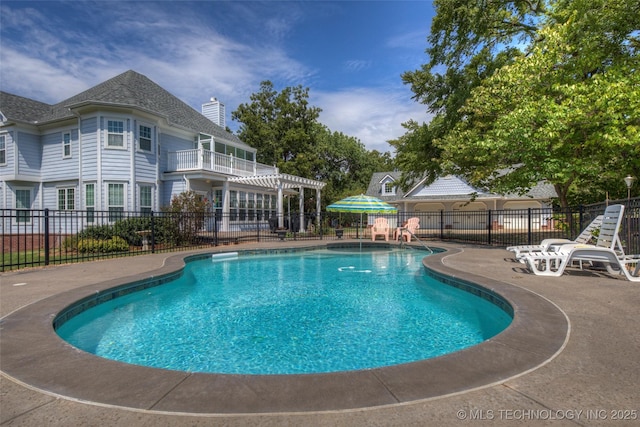 view of swimming pool with a fenced in pool, fence, a patio, and a pergola
