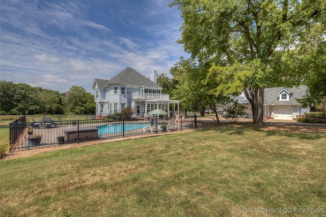 exterior space with a fenced in pool, fence, a patio, and a lawn