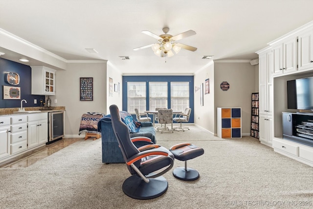 living room featuring wine cooler, light colored carpet, visible vents, and wet bar