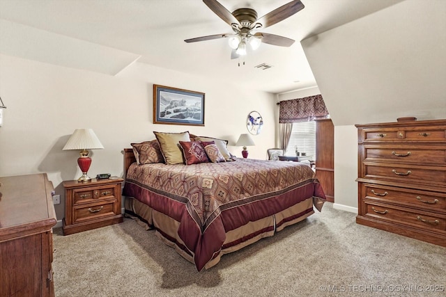 bedroom with baseboards, a ceiling fan, visible vents, and light colored carpet