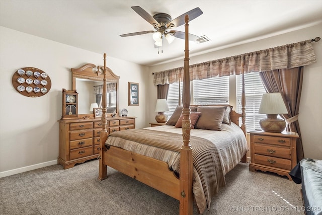 bedroom featuring a ceiling fan, light colored carpet, and baseboards