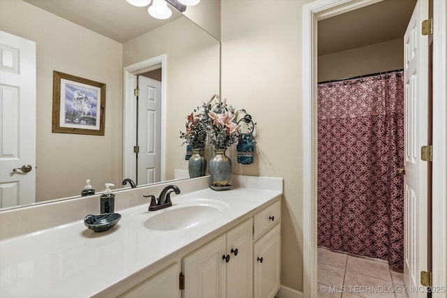 bathroom with a shower with shower curtain, vanity, and tile patterned floors