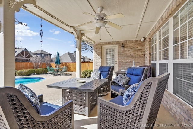 view of patio / terrace featuring outdoor dining space, a fenced backyard, ceiling fan, and an outdoor hangout area