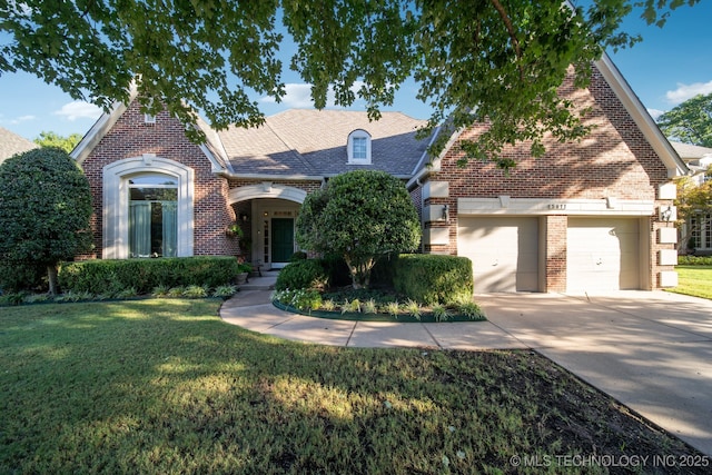 view of front facade featuring an attached garage, brick siding, concrete driveway, roof with shingles, and a front yard