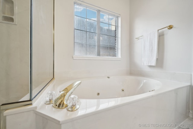 bathroom featuring a whirlpool tub