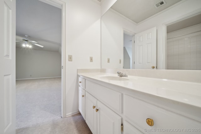 bathroom with ceiling fan, visible vents, baseboards, and vanity