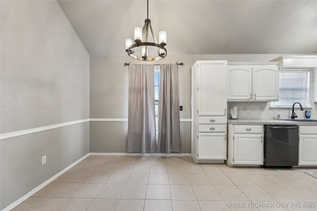 kitchen featuring a sink, black dishwasher, light countertops, vaulted ceiling, and decorative backsplash