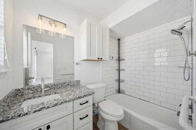 full bathroom with washtub / shower combination, toilet, a textured ceiling, and vanity