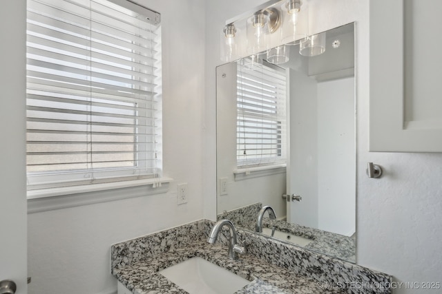 bathroom with a wealth of natural light and vanity