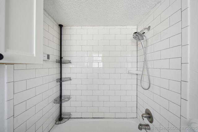 full bath featuring  shower combination and a textured ceiling