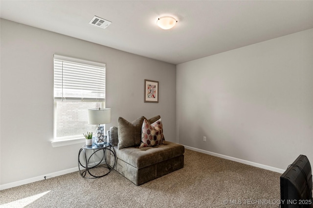 sitting room featuring carpet, visible vents, and baseboards