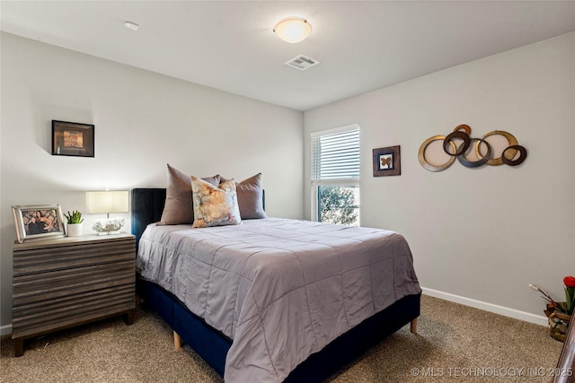 bedroom featuring light colored carpet, visible vents, and baseboards