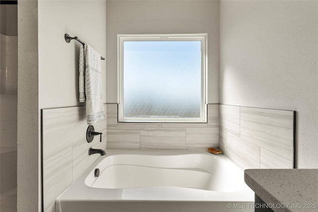 full bathroom with a garden tub